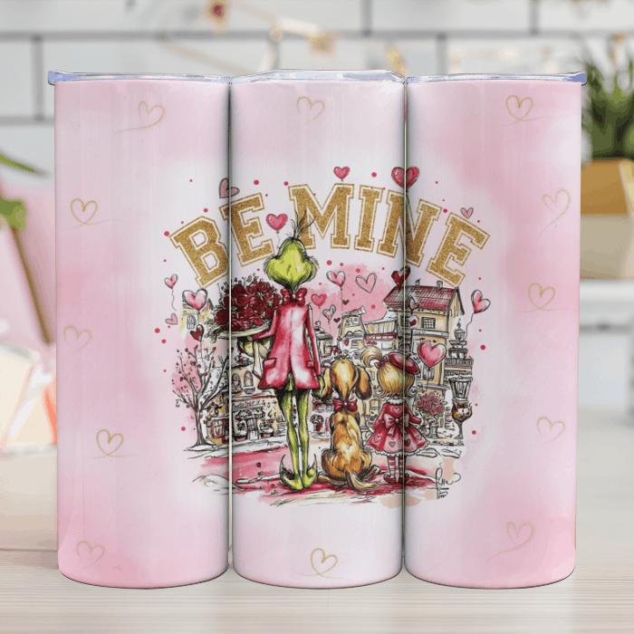 Pink tumblers with Valentine's Day design featuring hearts and 'Be Mine' text.