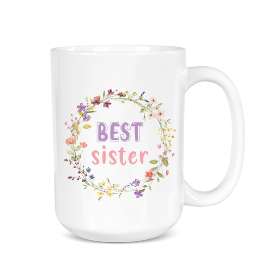 White mug with floral design and 'Best Sister' text on a white background