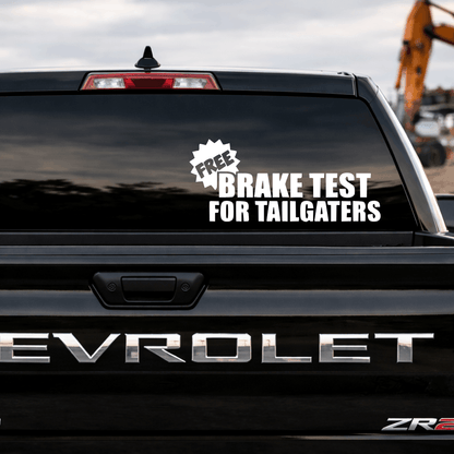 Chevrolet vehicle with a humorous 'Free Brake Test for Tailgaters' decal on the back window.