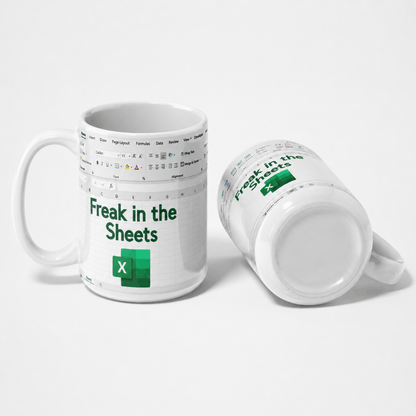 A white ceramic mug printed with an Excel spreadsheet design and the green text 'Freak in the Sheets' alongside the Excel logo, shown from two angles on a light gray background.