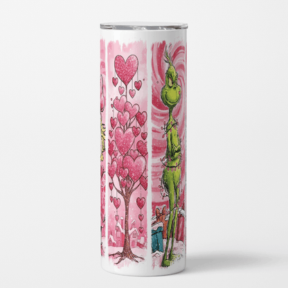 Tumbler with a green character and pink hearts on a white background