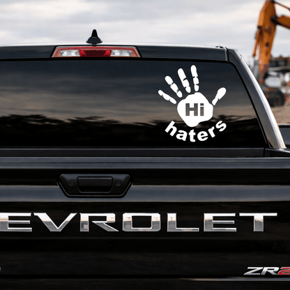 Chevrolet vehicle with a decal reading 'Hi haters' on the back window.