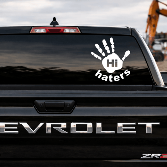 Chevrolet vehicle with a decal reading 'Hi haters' on the back window.