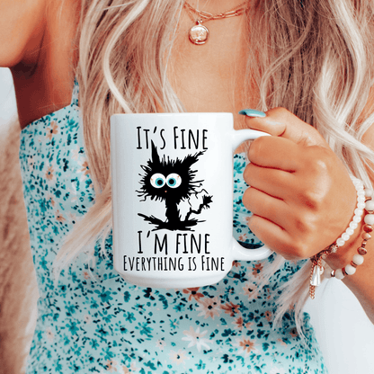 White 15 oz ceramic mug with stressed black cat and funny mental health saying