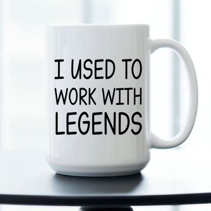 White mug with text 'I used to work with legends'.