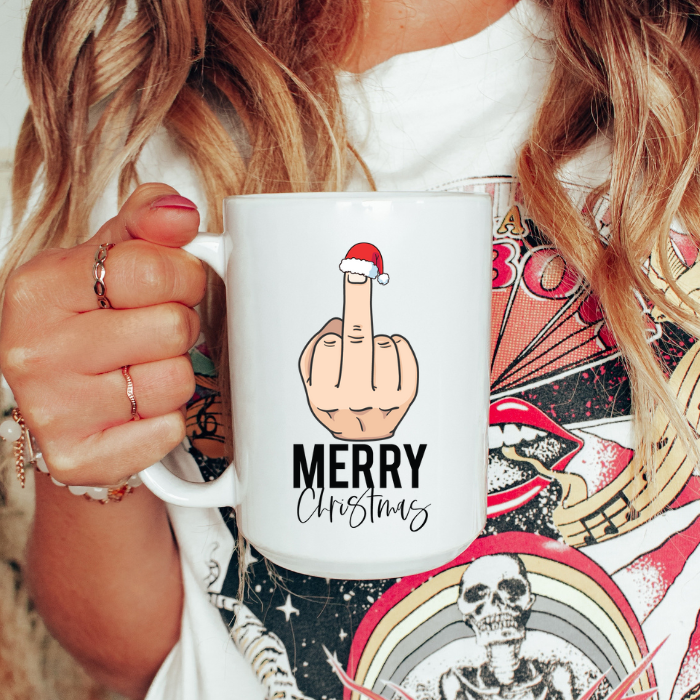 Person holding a mug with a graphic design and text