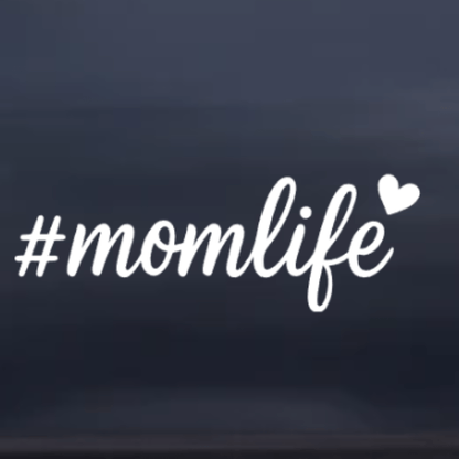 White '#momlife' text with a heart on a dark blue background