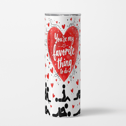 Tumbler with a red heart and text on a white background