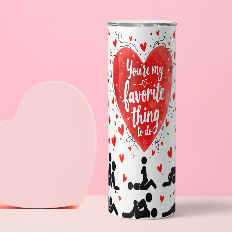 Tumbler with heart design and text on a pink background