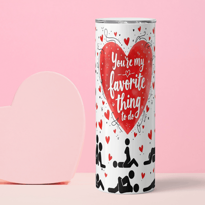 Tumbler with heart design and text on a pink background