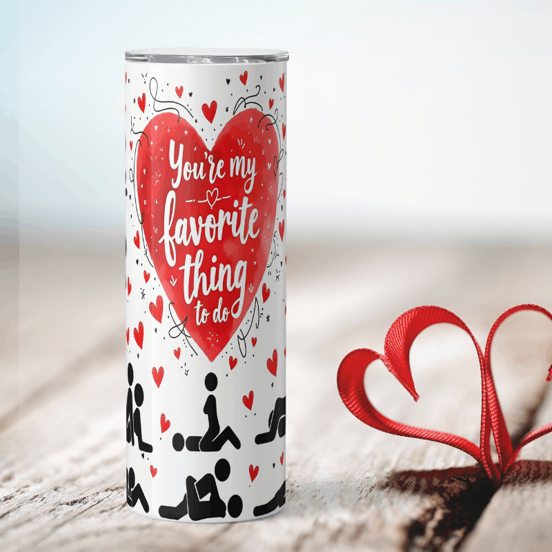 Tumbler with heart design and text 'You're my favorite thing to do' on a light background