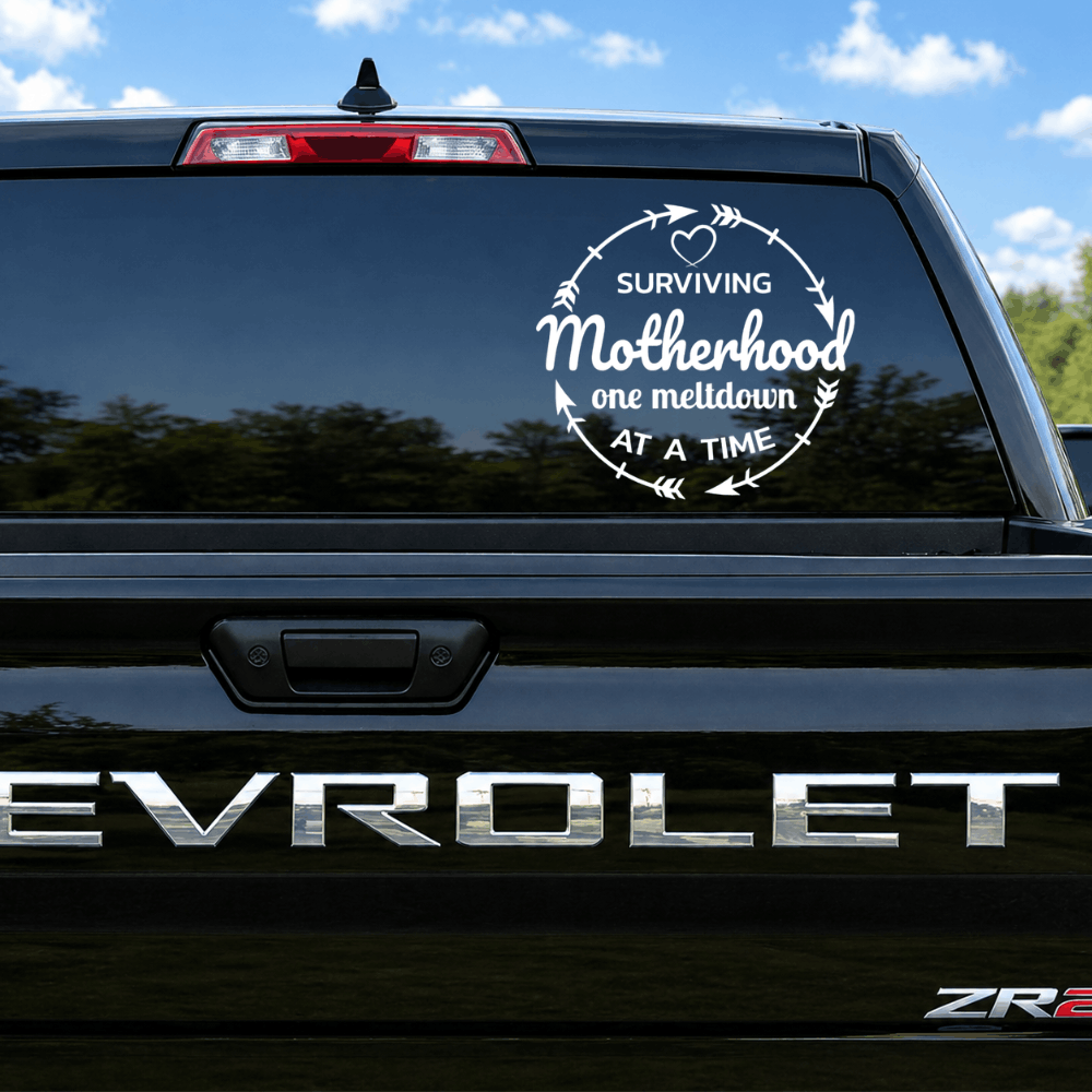 Chevrolet vehicle with a humorous 'Surviving Motherhood' decal on the back window.