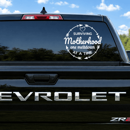 Chevrolet vehicle with a humorous 'Surviving Motherhood' decal on the back window.