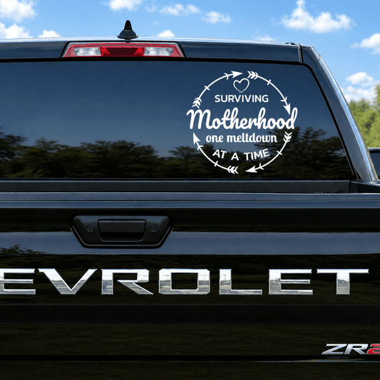 Chevrolet vehicle with a humorous 'Surviving Motherhood' decal on the back window.