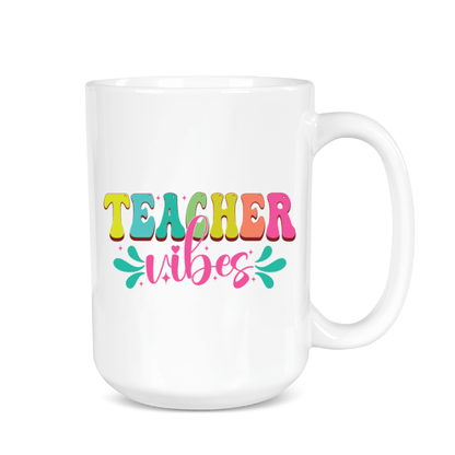 White mug with colorful 'Teacher Vibes' text on a white background
