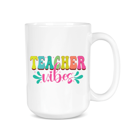 White mug with colorful 'Teacher Vibes' text on a white background