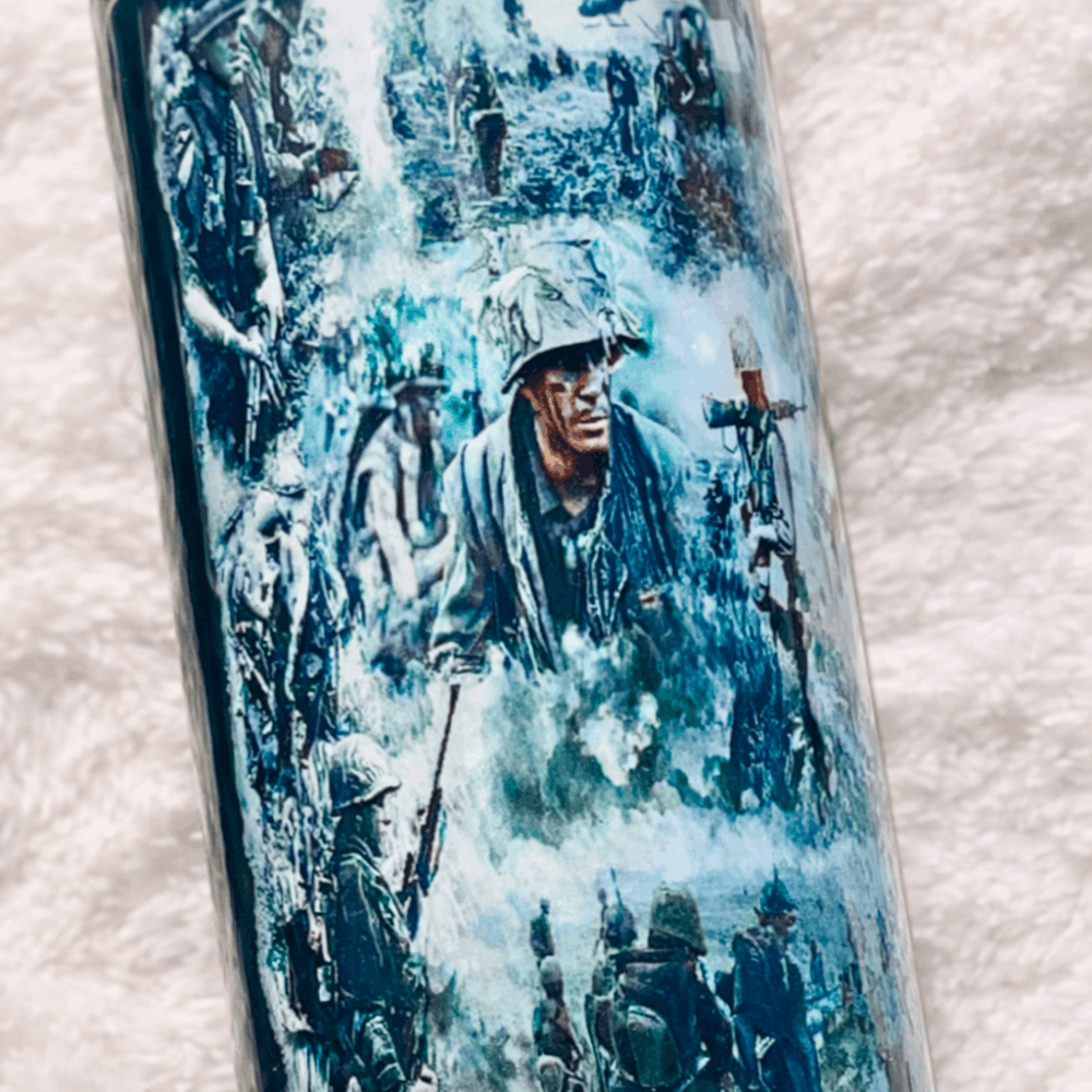 Tumbler with military-themed design on a textured surface