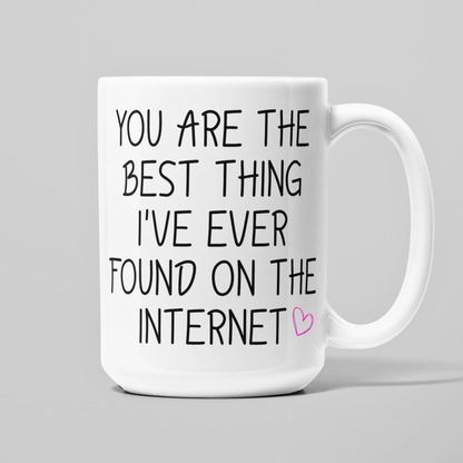 White 15 oz coffee mug with You Are the Best Thing I've Ever Found on the Internet quote and pink heart.