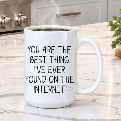 White ceramic love coffee mug featuring a sweet internet relationship quote in black text with pink heart accent.